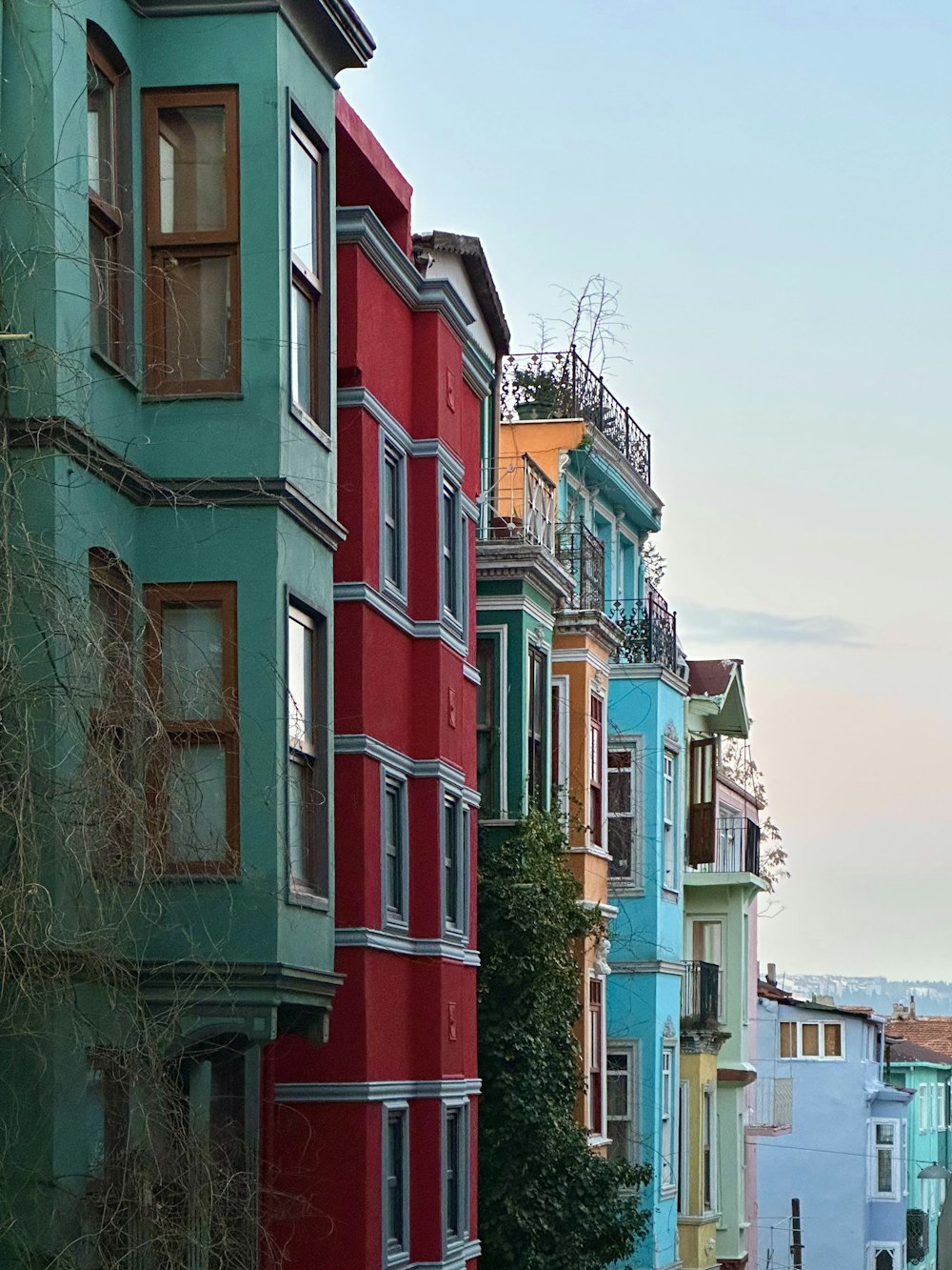 a row of multicolored buildings along a street