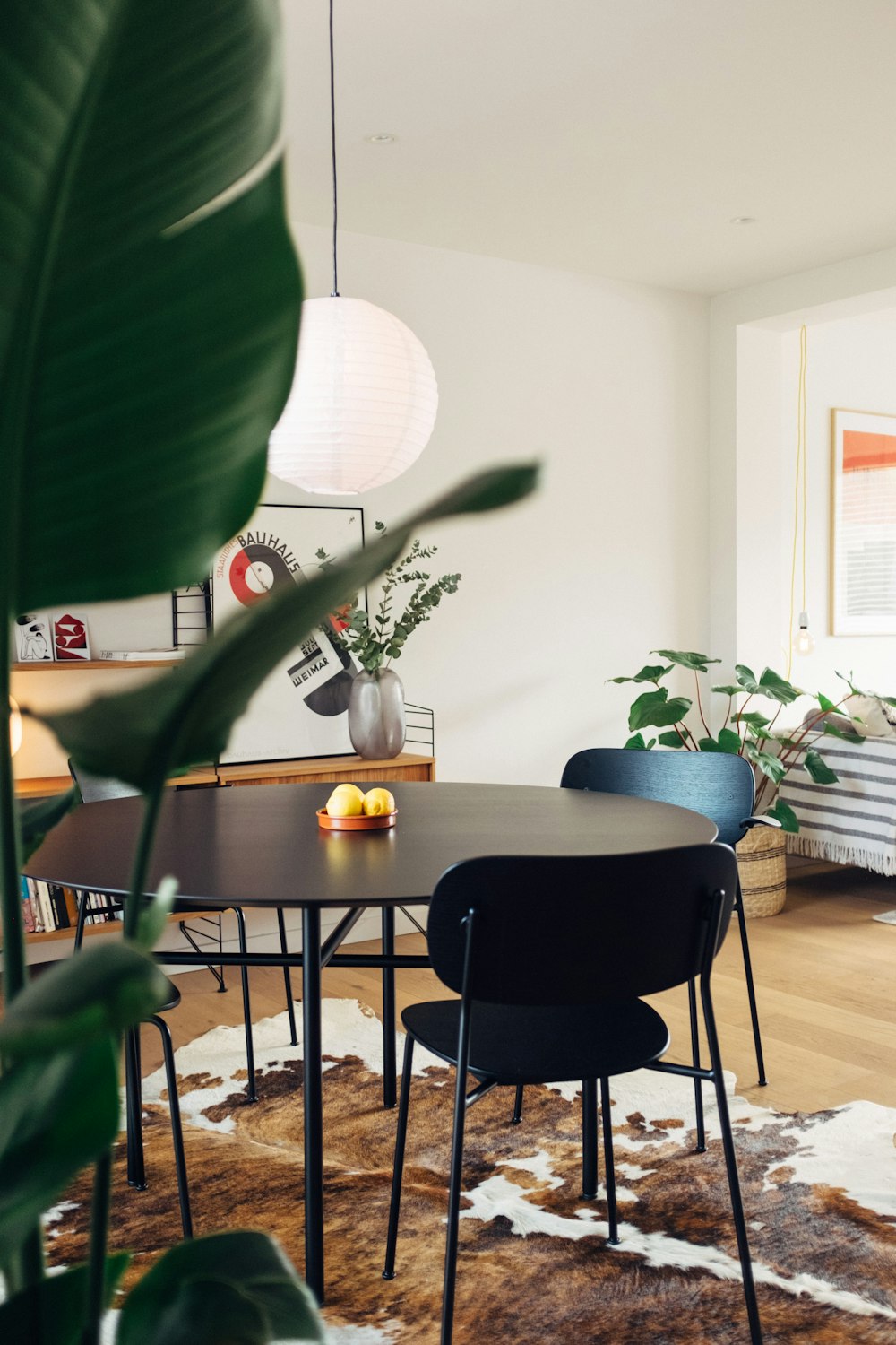 a dining room with a table and chairs