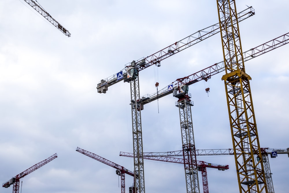 a group of cranes that are next to each other