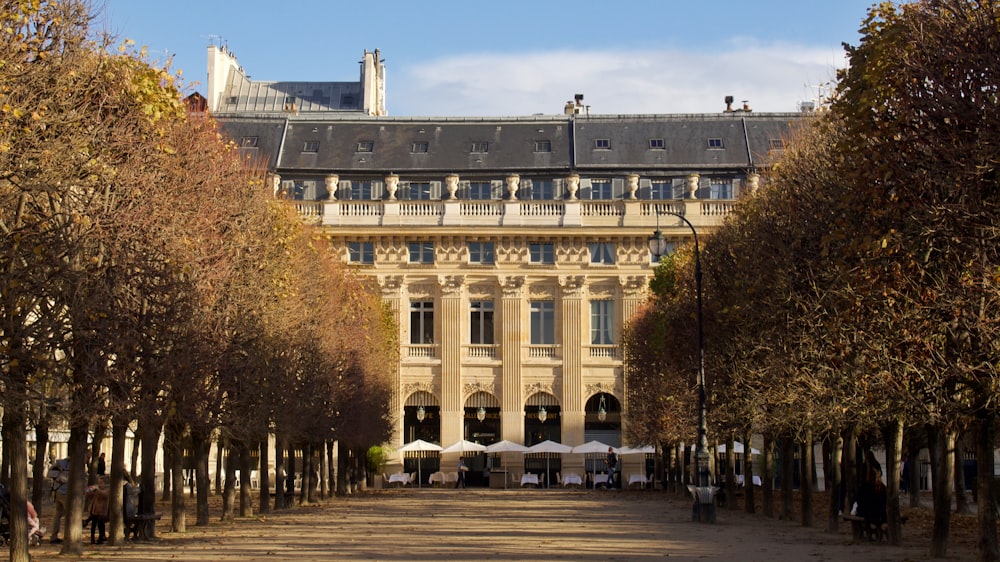 a large building with a lot of trees in front of it