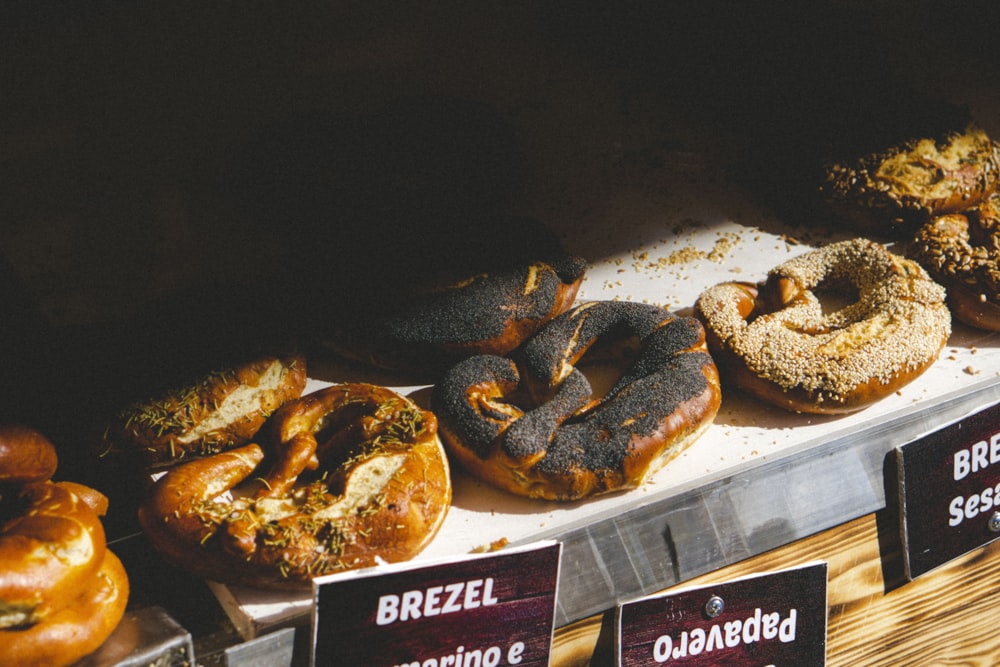 a display case filled with lots of different types of doughnuts