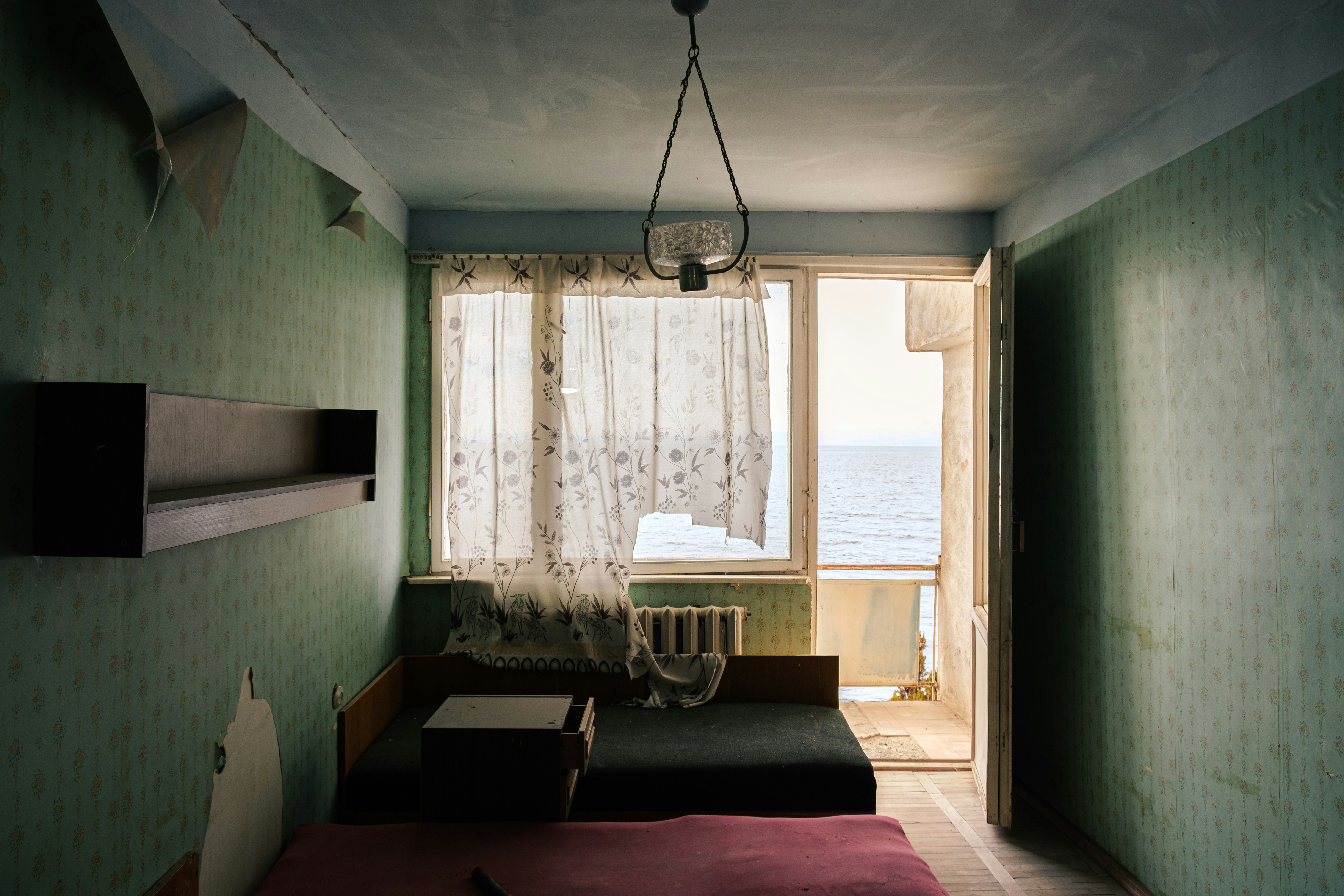 a room with a bed and a window