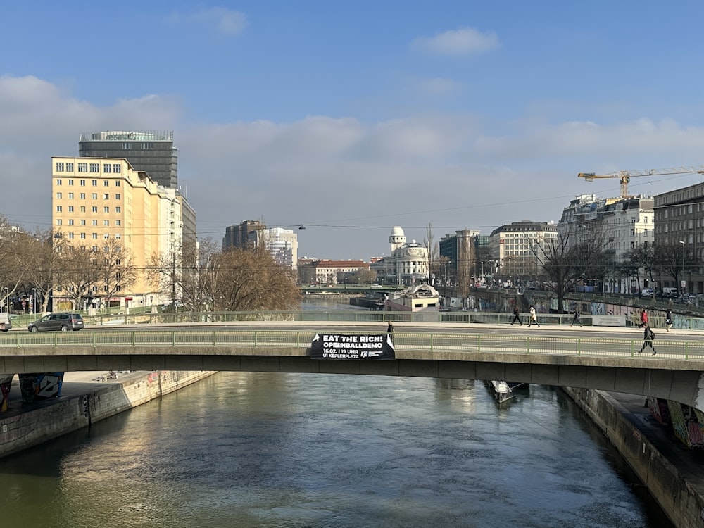 a bridge over a body of water in a city