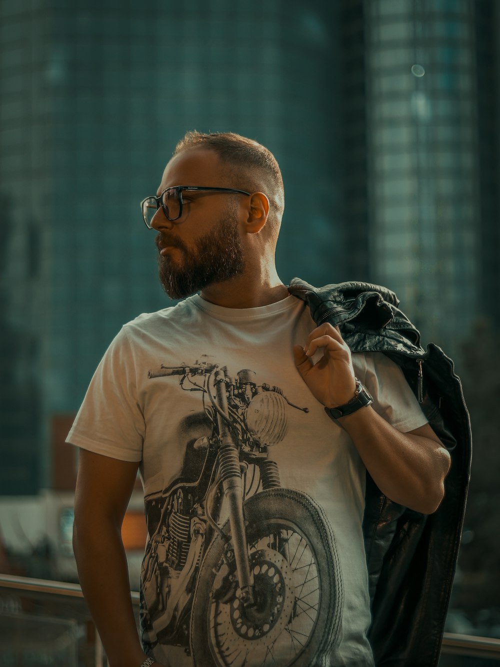 a man with a beard wearing a motorcycle t - shirt