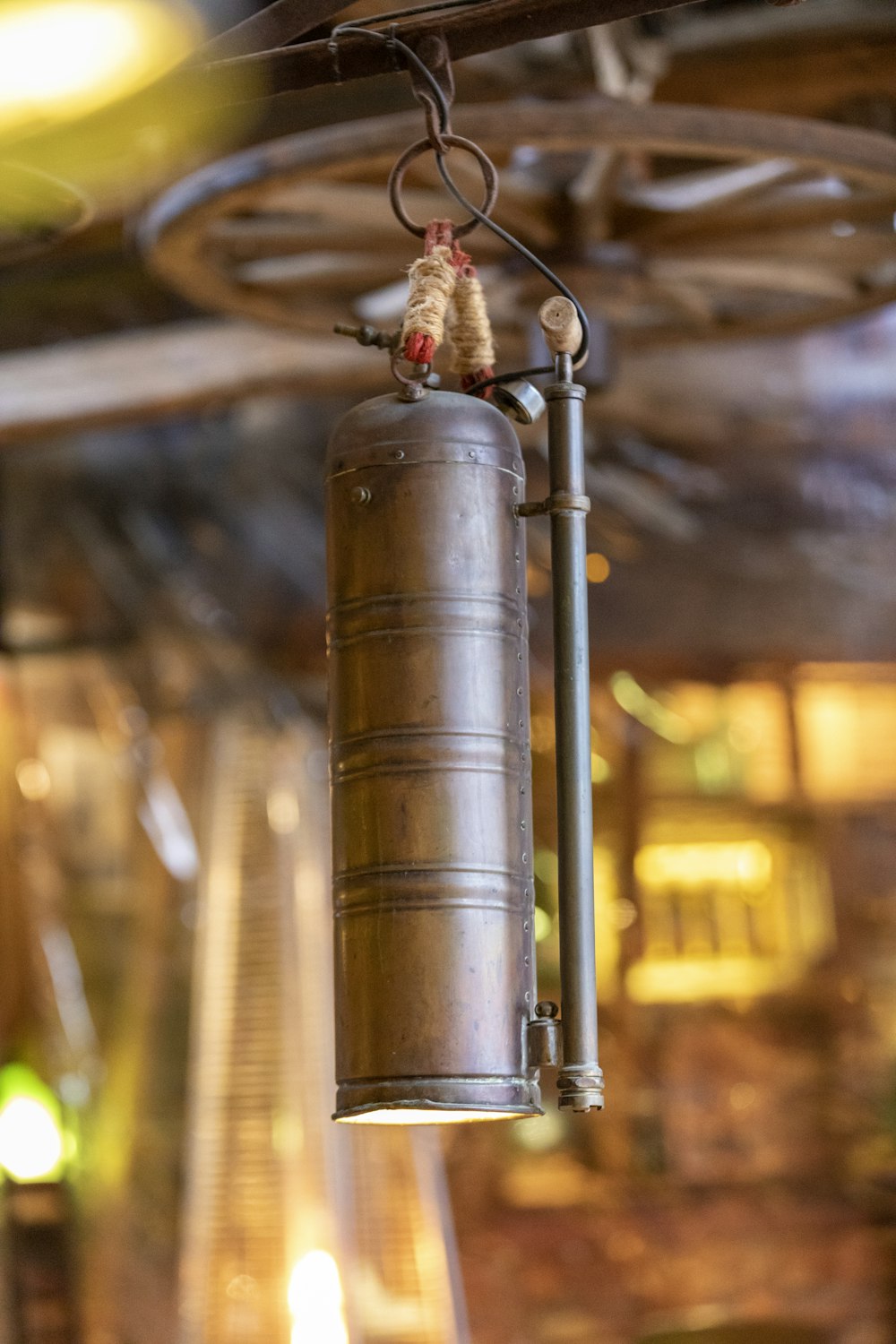 a bell hanging from a ceiling in a room