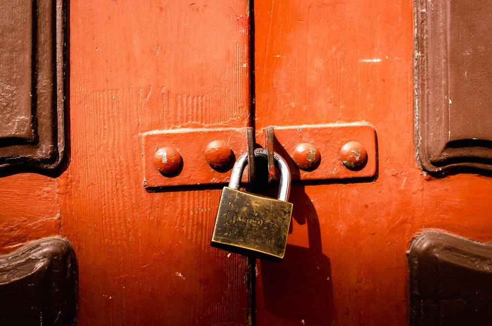 a close up of a door with a padlock on it