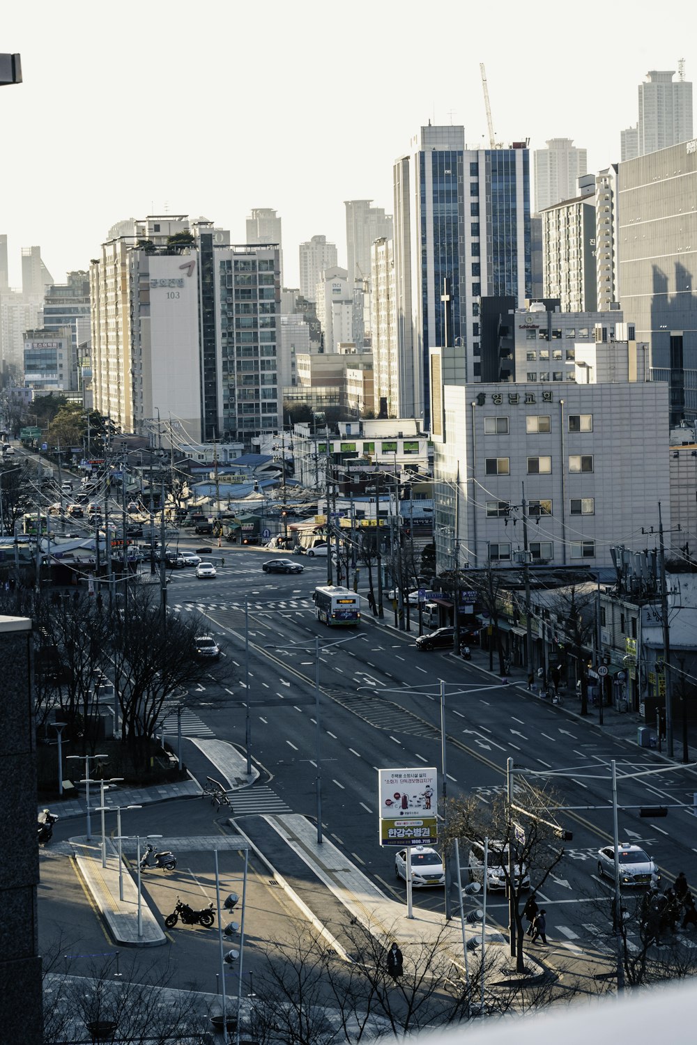 a view of a city street with a lot of tall buildings