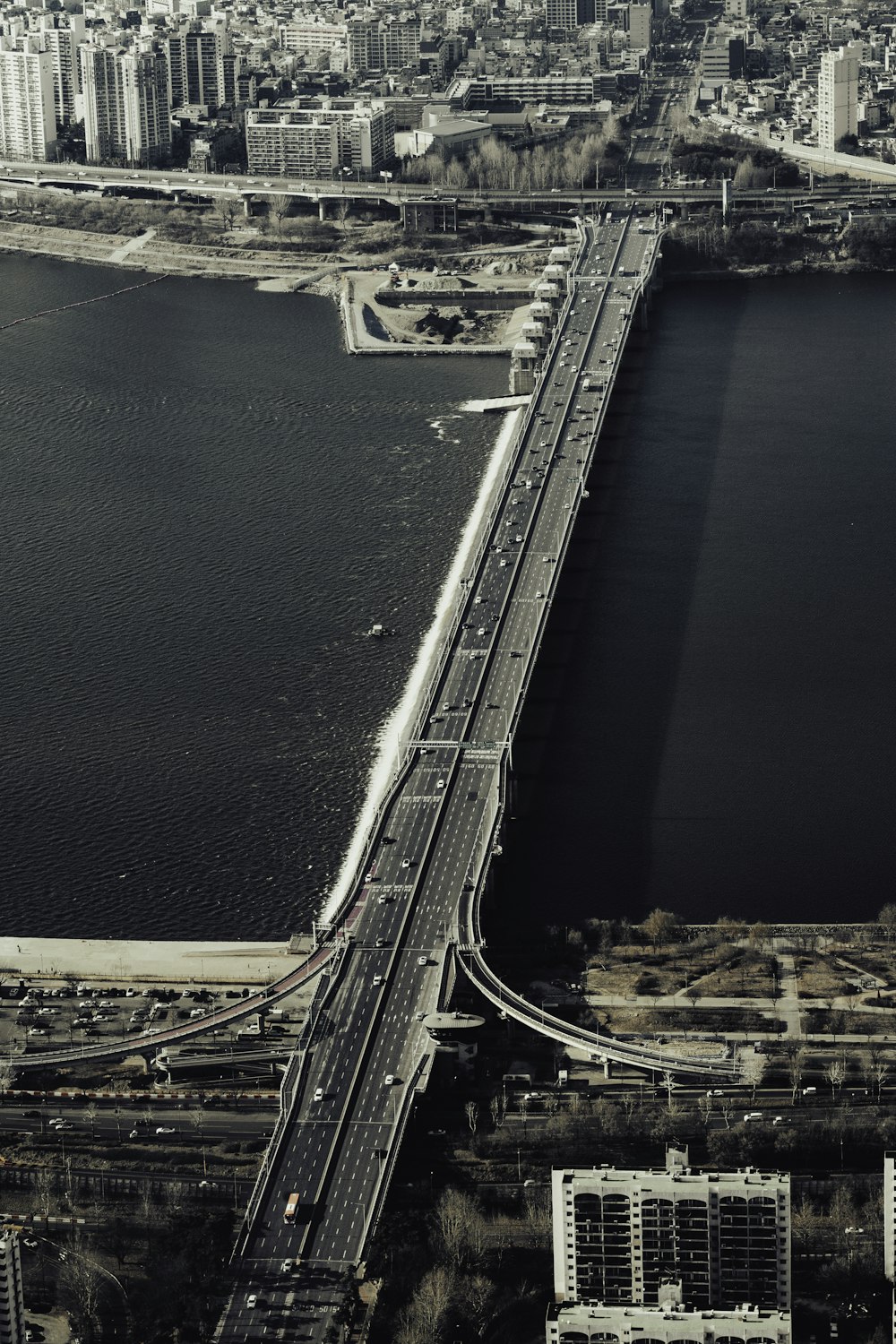 an aerial view of a bridge over a large body of water