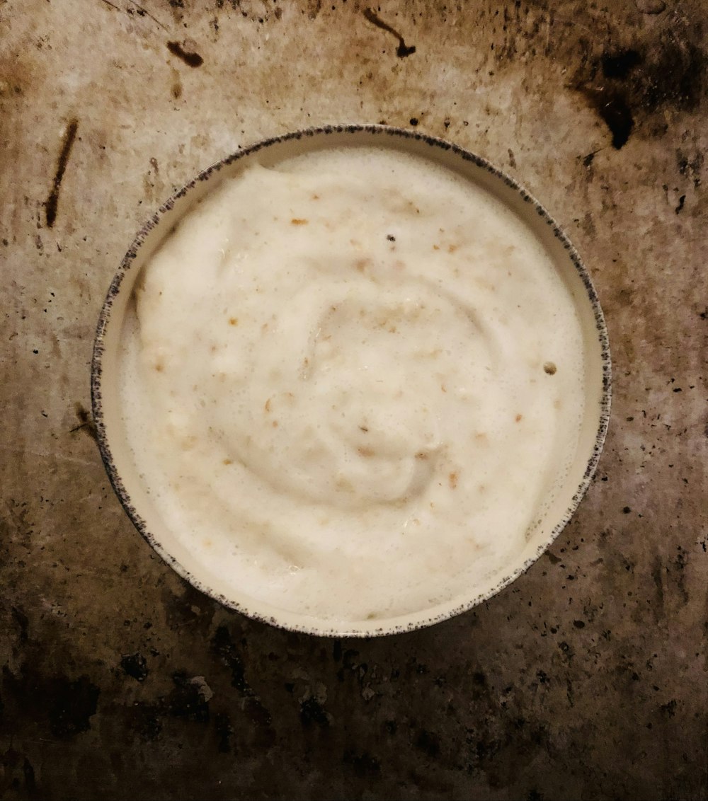 a bowl of food sitting on top of a table