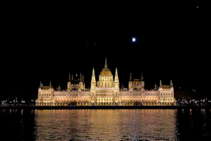 A serene evening shot of the academy’s main building illuminated softly against the twilight.