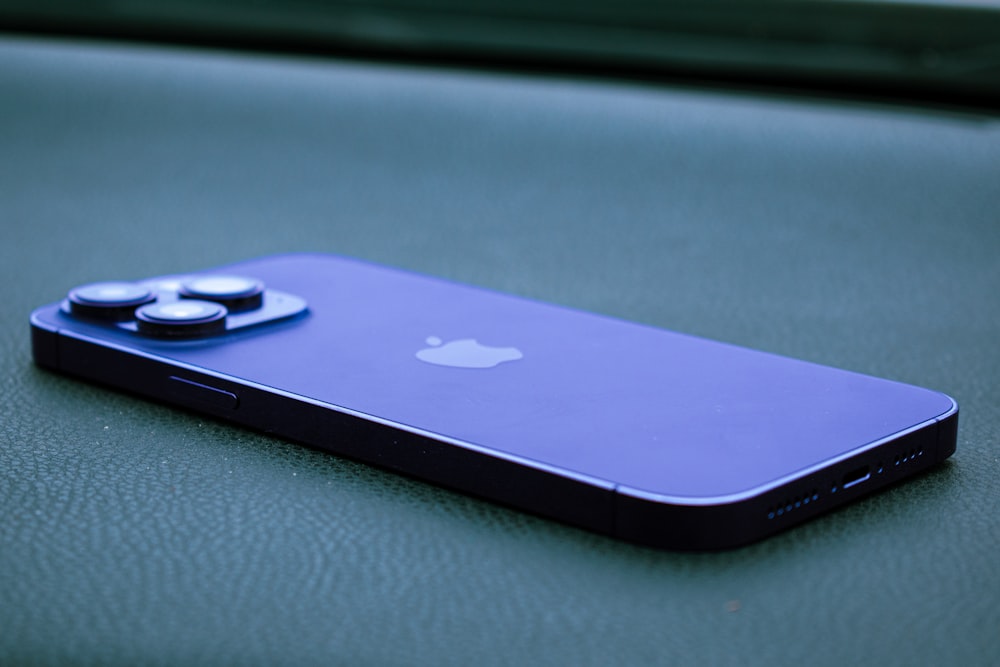 a close up of a cell phone on a table