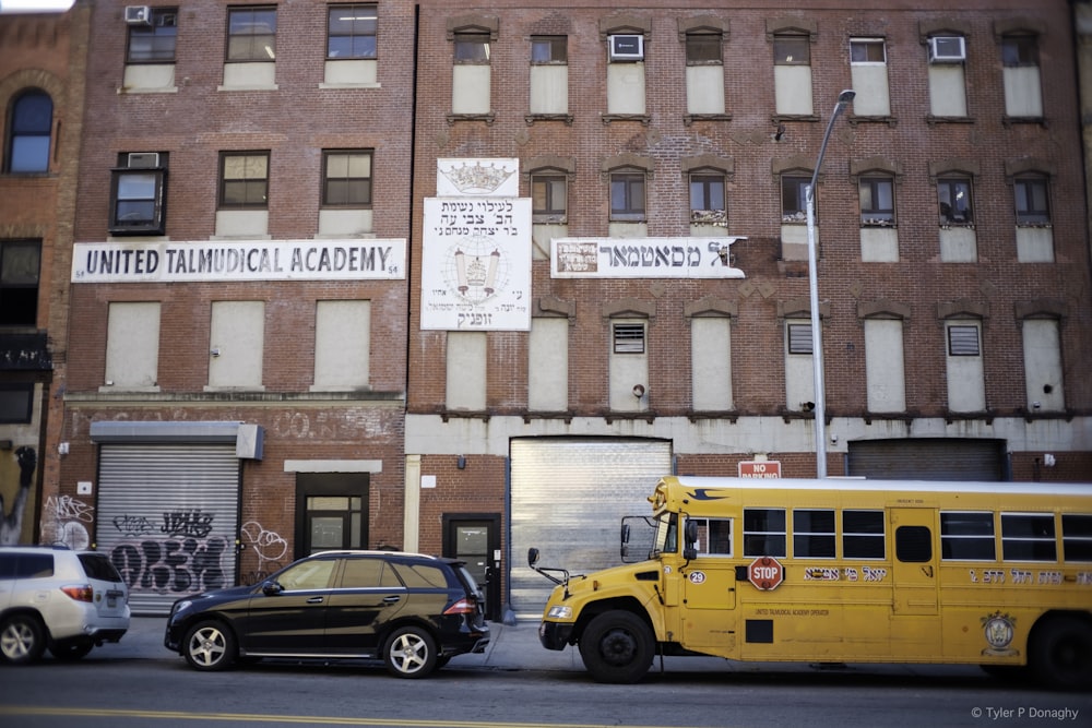 a yellow school bus parked in front of a building