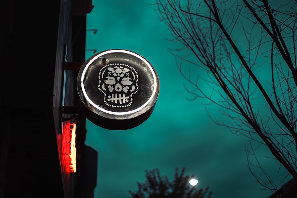 a neon sign that has a skull on it