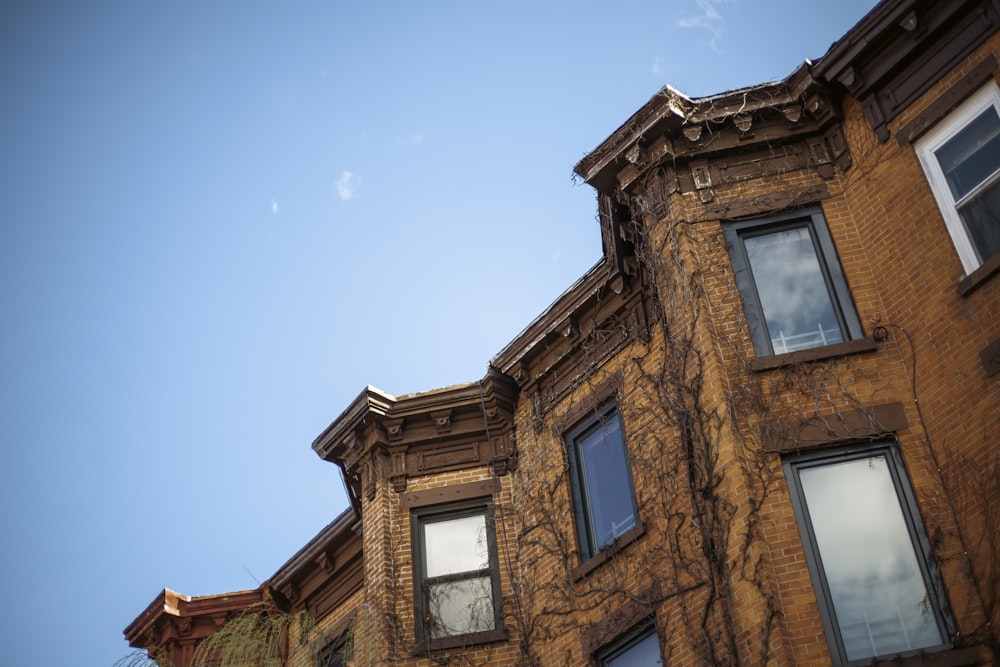 a tall building with many windows and a sky background