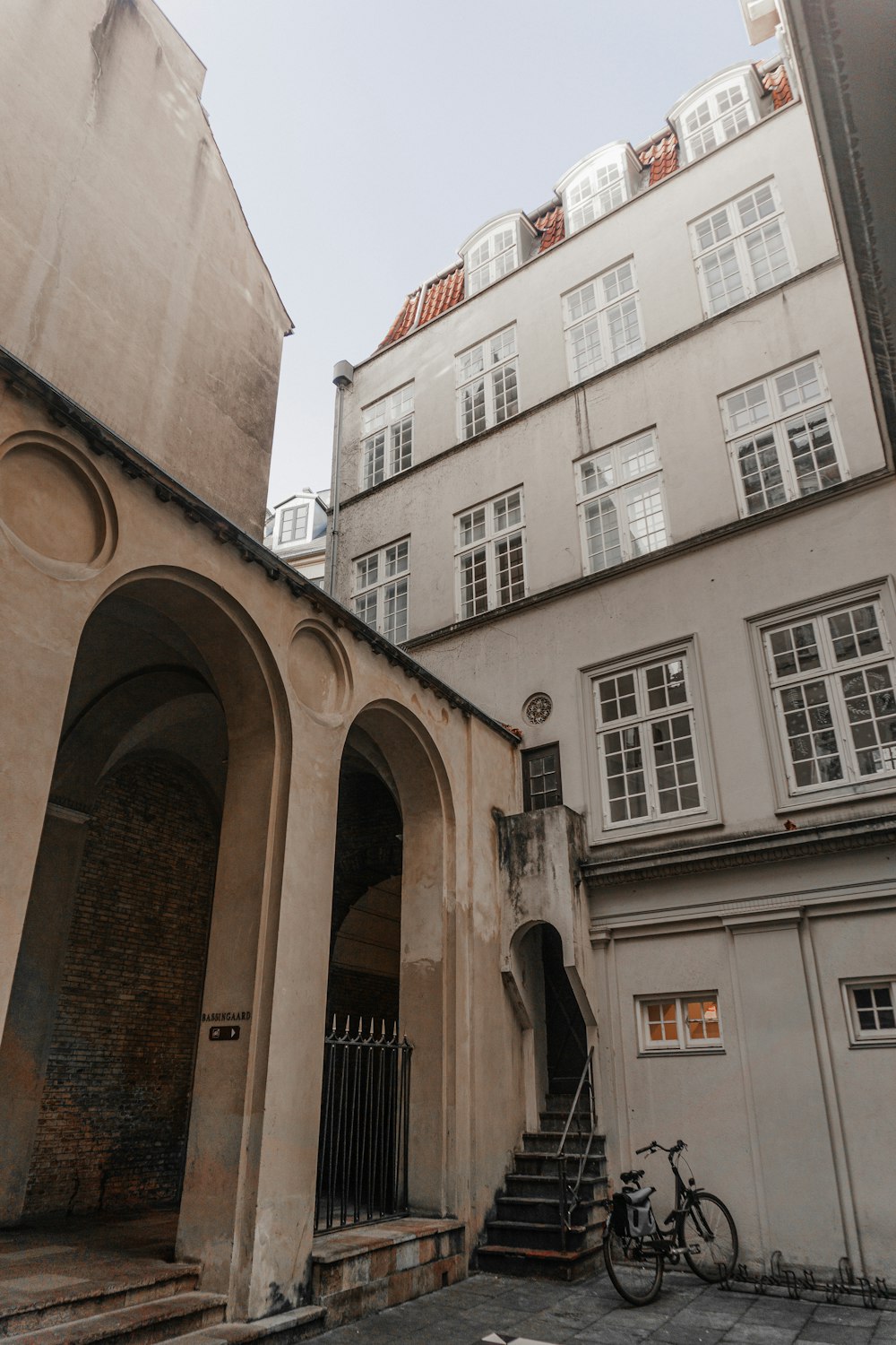 a bike is parked in front of a building