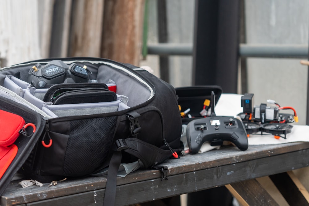 a back pack sitting on top of a wooden table