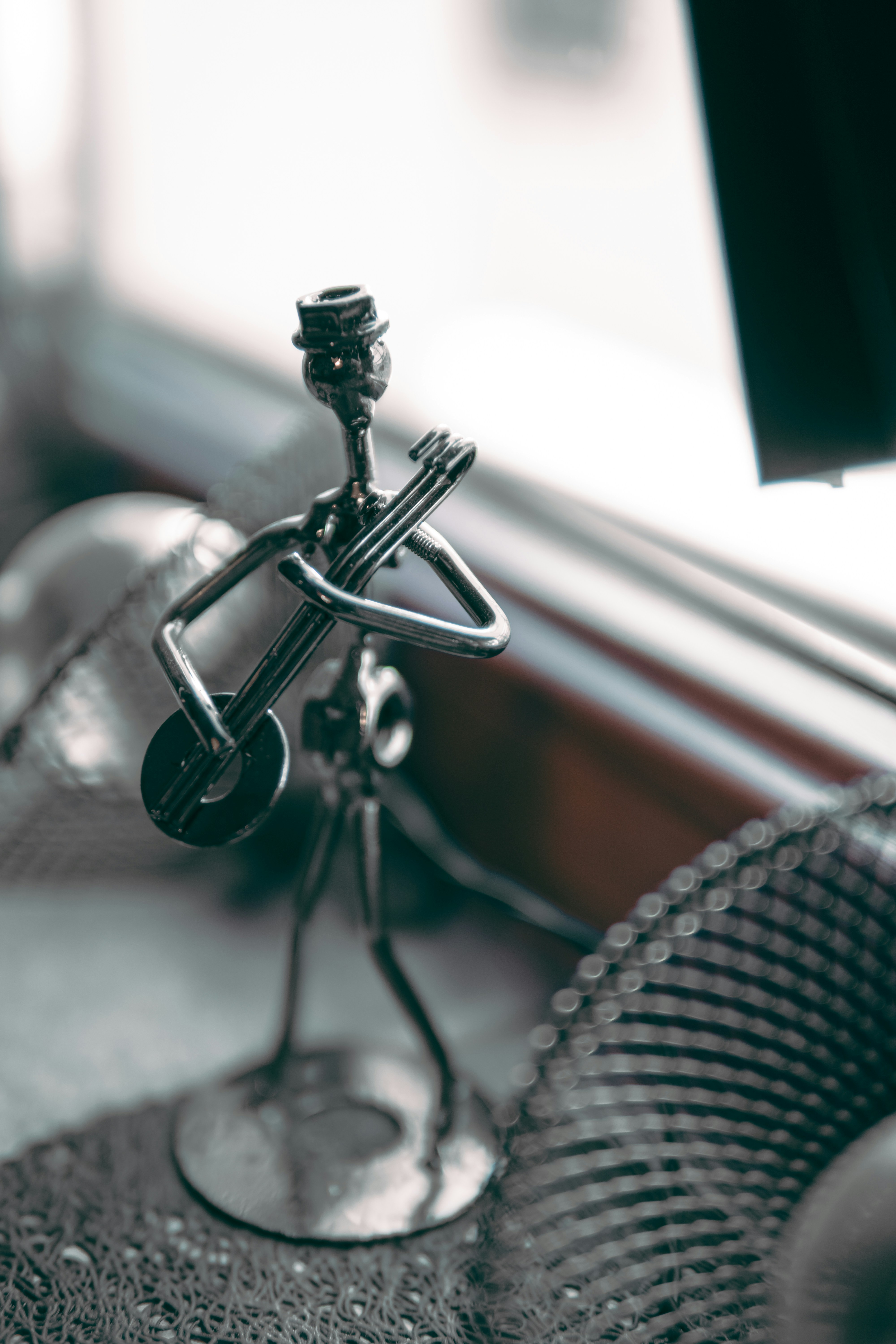 a metal object sitting on top of a table next to a window