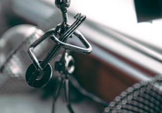 a metal object sitting on top of a table next to a window