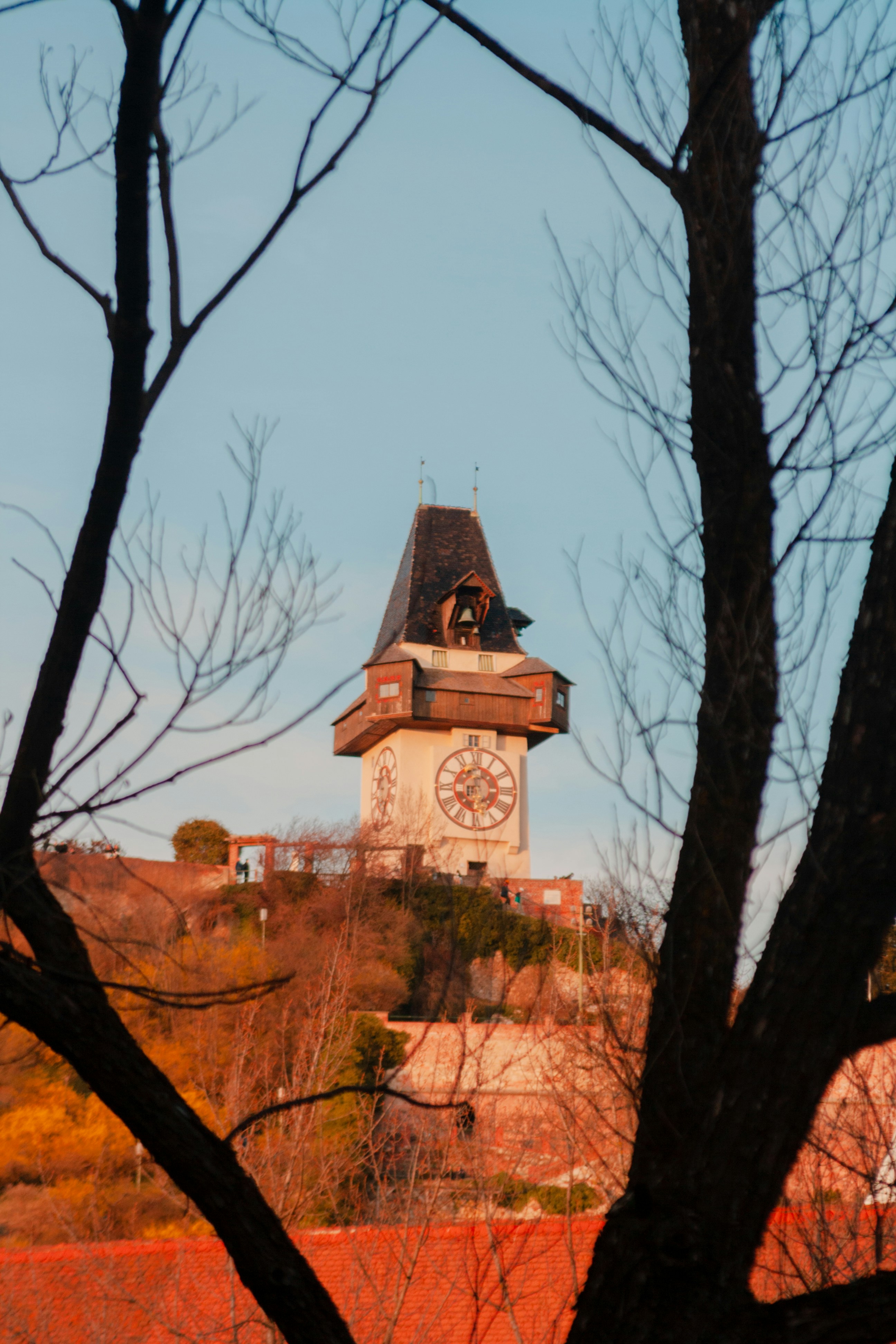 a clock tower with a bell on top of it