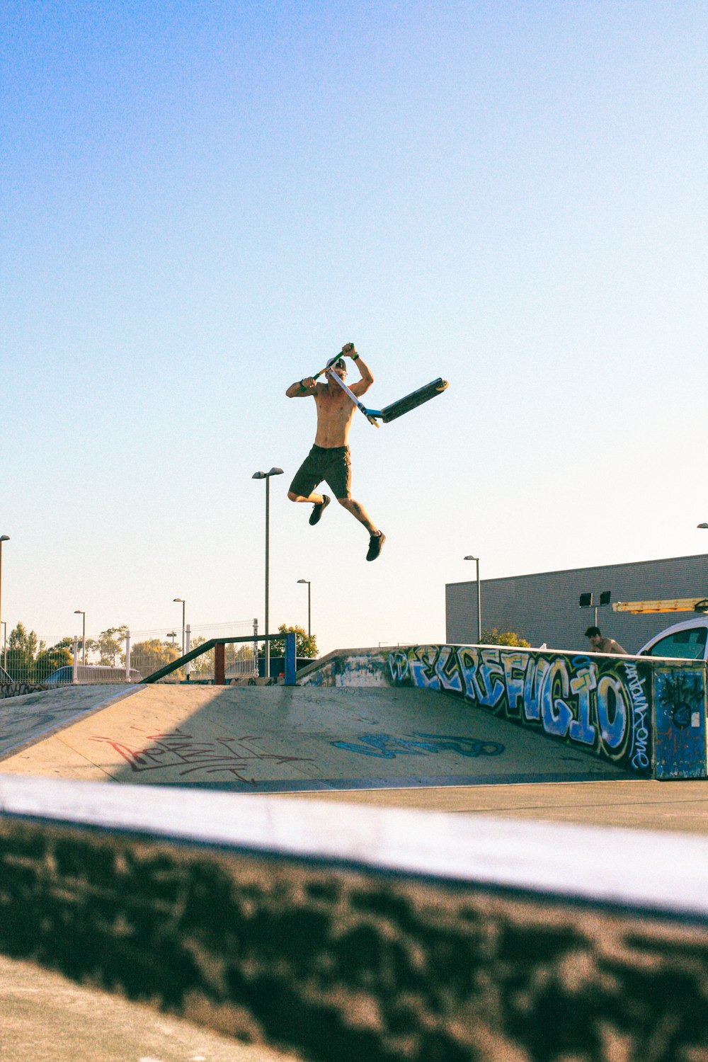 a man flying through the air while riding a skateboard