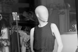 Side profile of a casual dress mockup displayed on a minimalist mannequin.