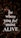 Bold, white text with the motivational message 'be where you feel most ALIVE' is overlaying a background of dark, leafy foliage. The leaves are predominantly dark green with earthy brown and muted red tones, contributing to a natural and organic look.