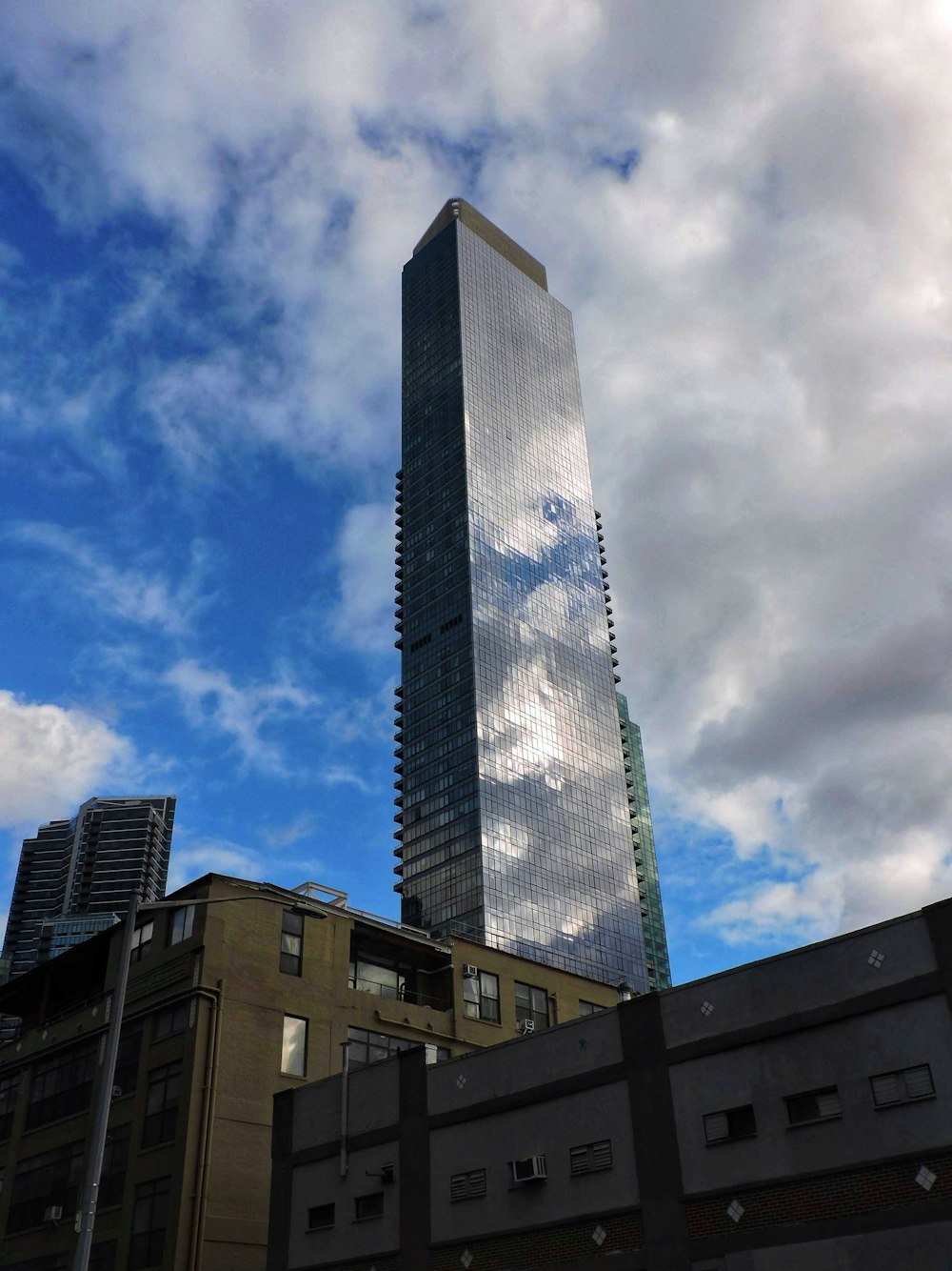 a very tall building with a sky background