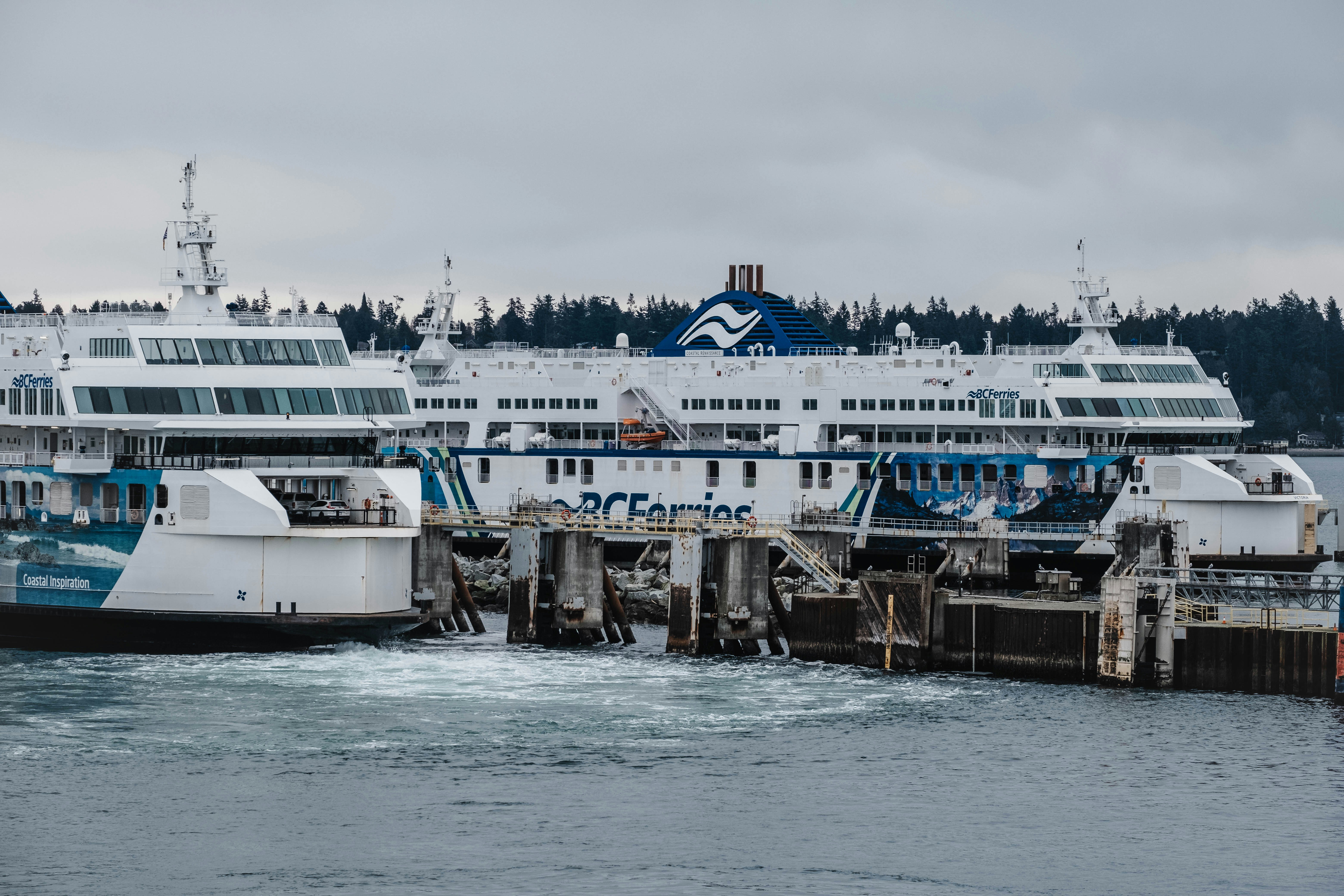 a large white and blue boat in a body of water