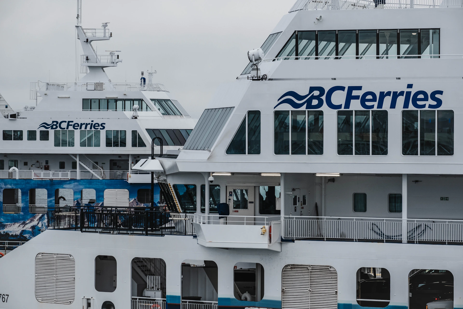 a couple of large white boats parked next to each other