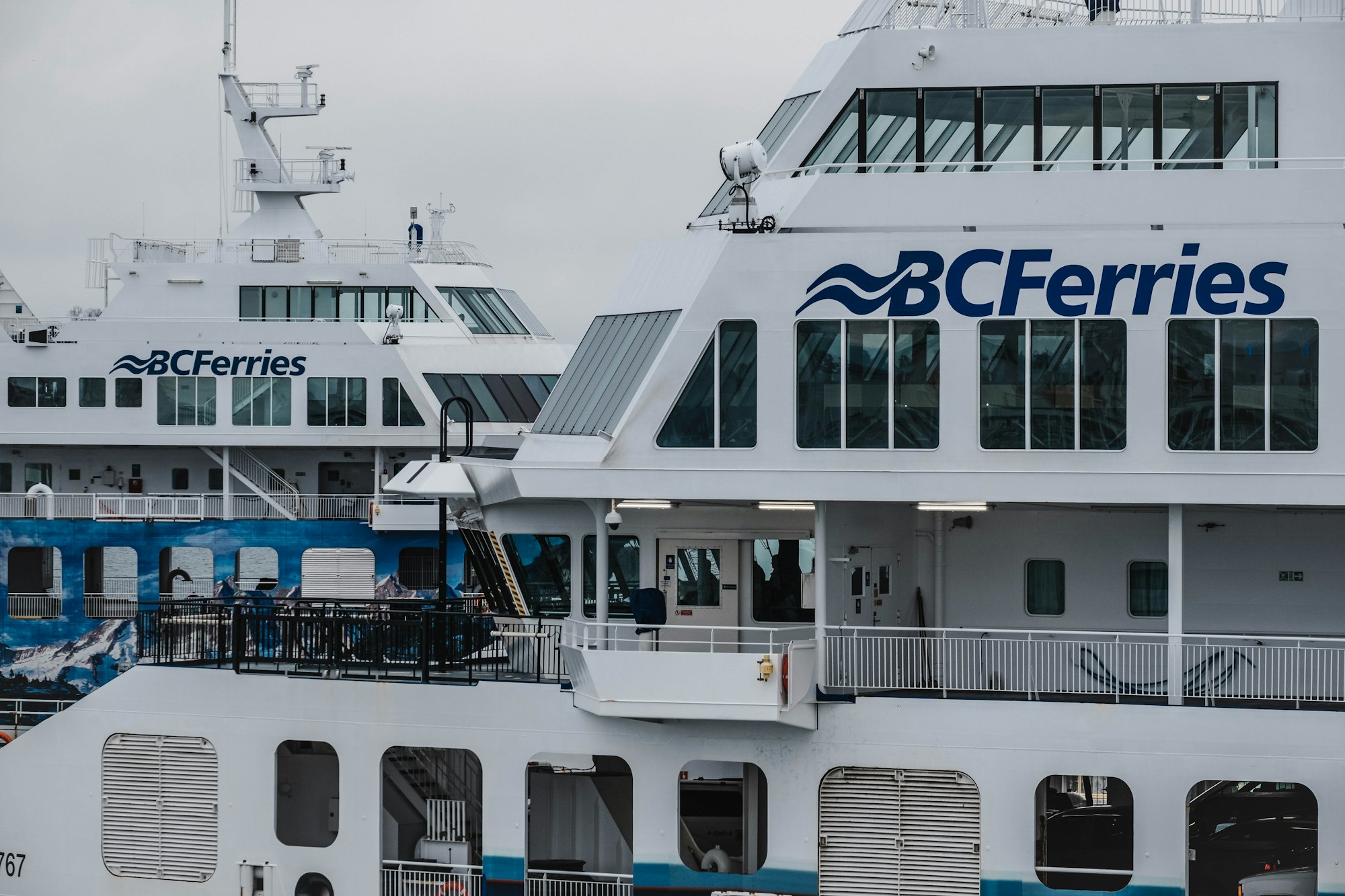 a couple of large white boats parked next to each other
