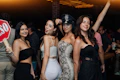 a group of women standing next to each other