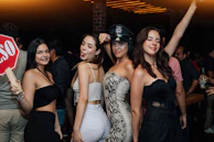 a group of women standing next to each other