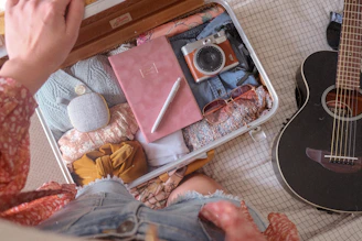 Open carry-on suitcase neatly packed with travel essentials