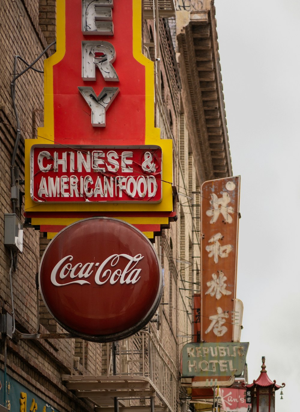 a chinese and american food restaurant on a city street