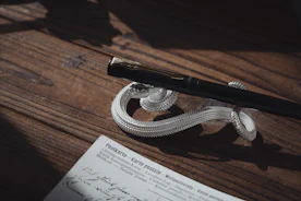 a pen sitting on top of a wooden table