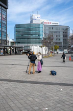 A cinematic shot of a creator filming vibrant street scenes in a colorful Latin American city.