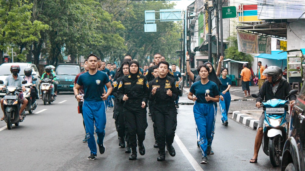 a group of people that are walking down the street