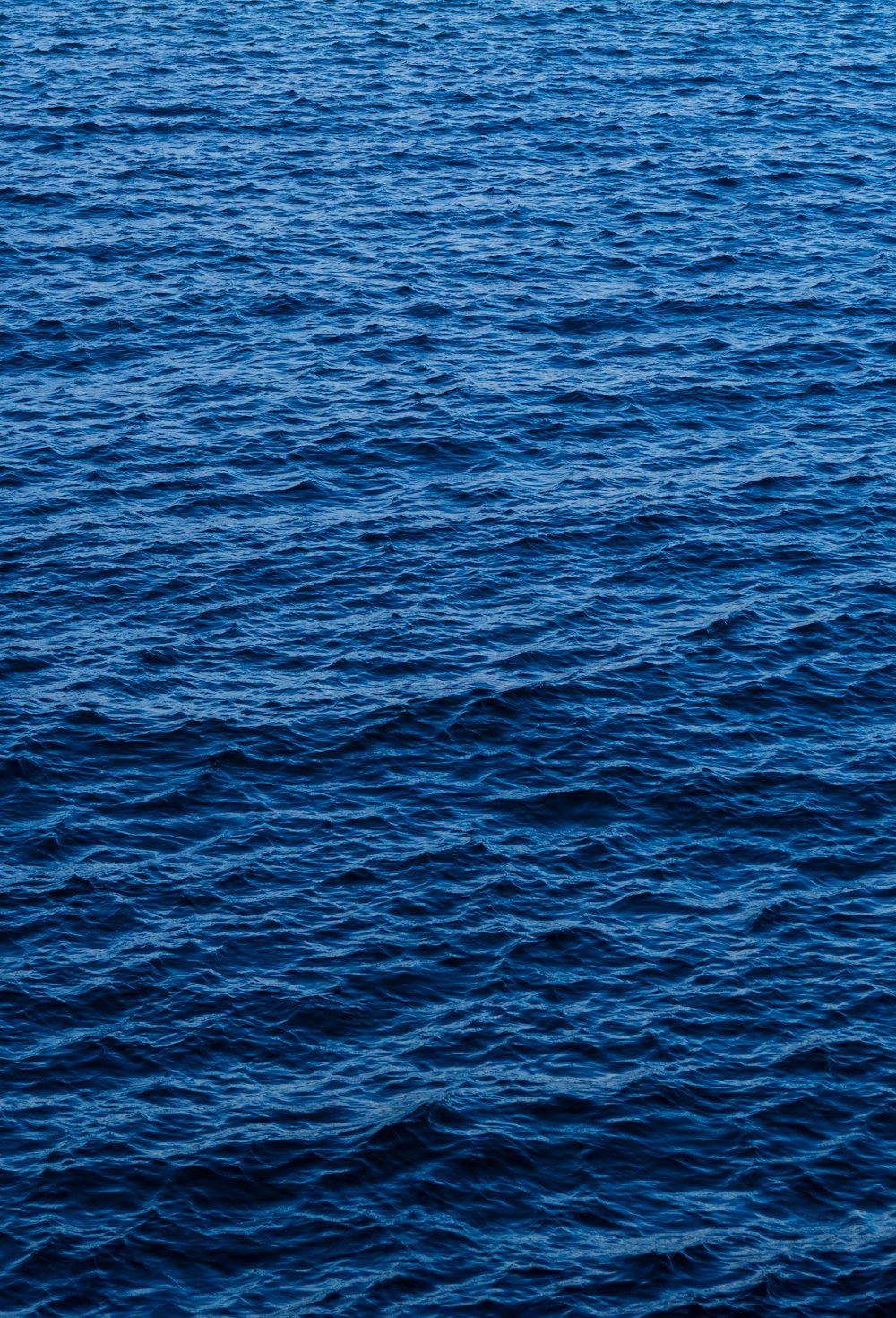 a boat floating on top of a large body of water