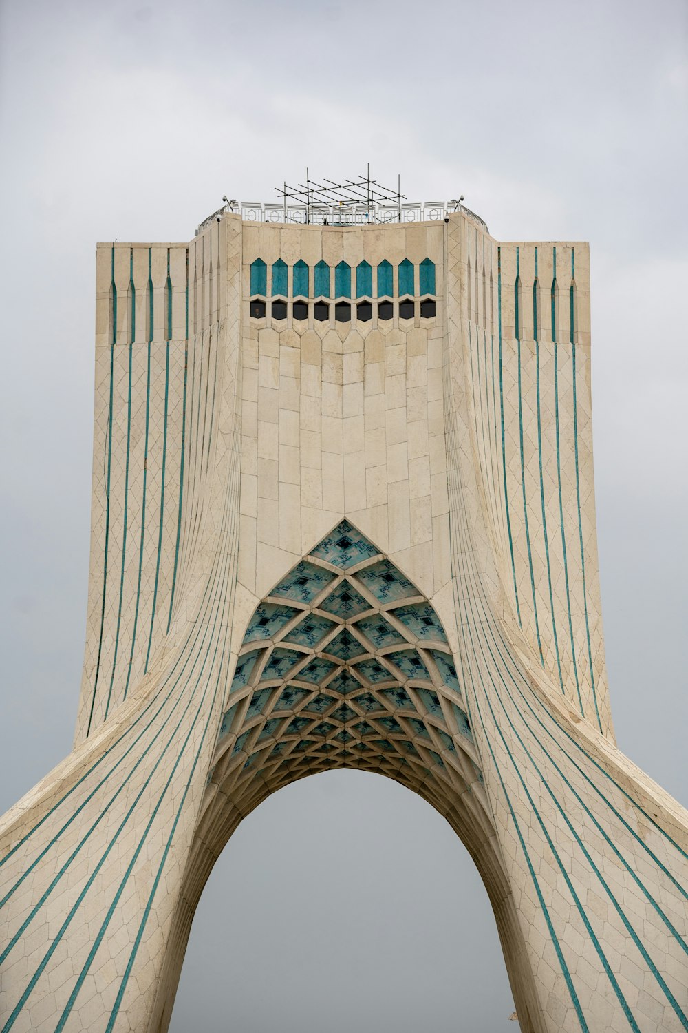 a very tall building with a sky background