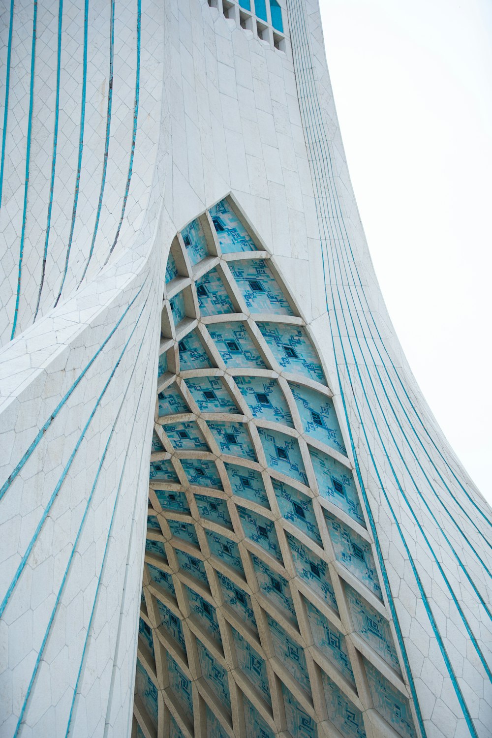 a very tall building with a clock on it's side