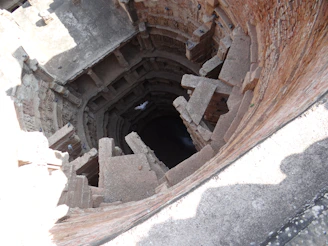 Ancient stepwell with intricate stone carvings reflecting centuries of history.