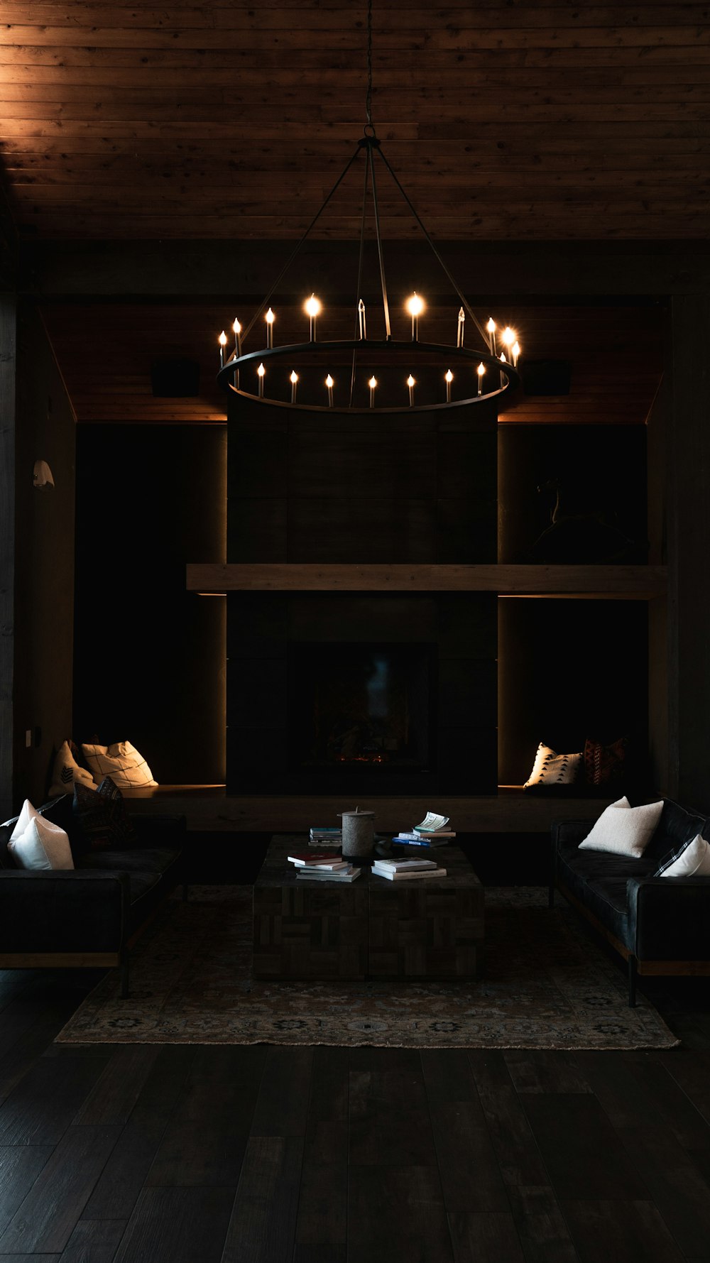 a living room filled with furniture and a chandelier