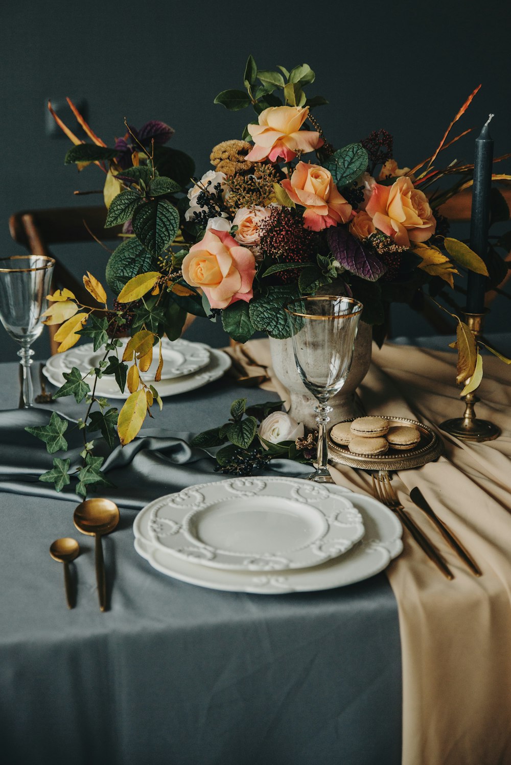 a table topped with a vase filled with flowers