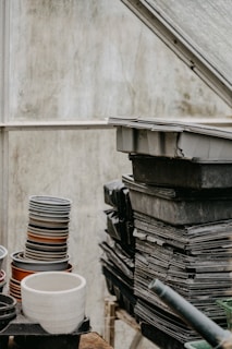 Stacks of plastic pots and pans collected from growers, prepared for recycling processing.