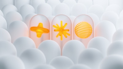 a group of white eggs with yellow designs on them