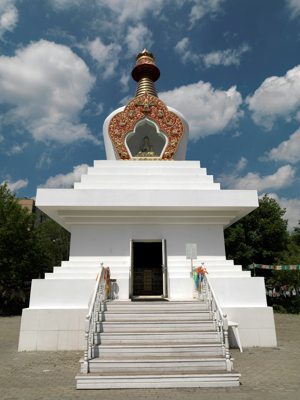 a large white building with steps leading up to it