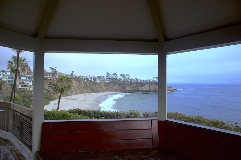 a view of the ocean from a covered porch