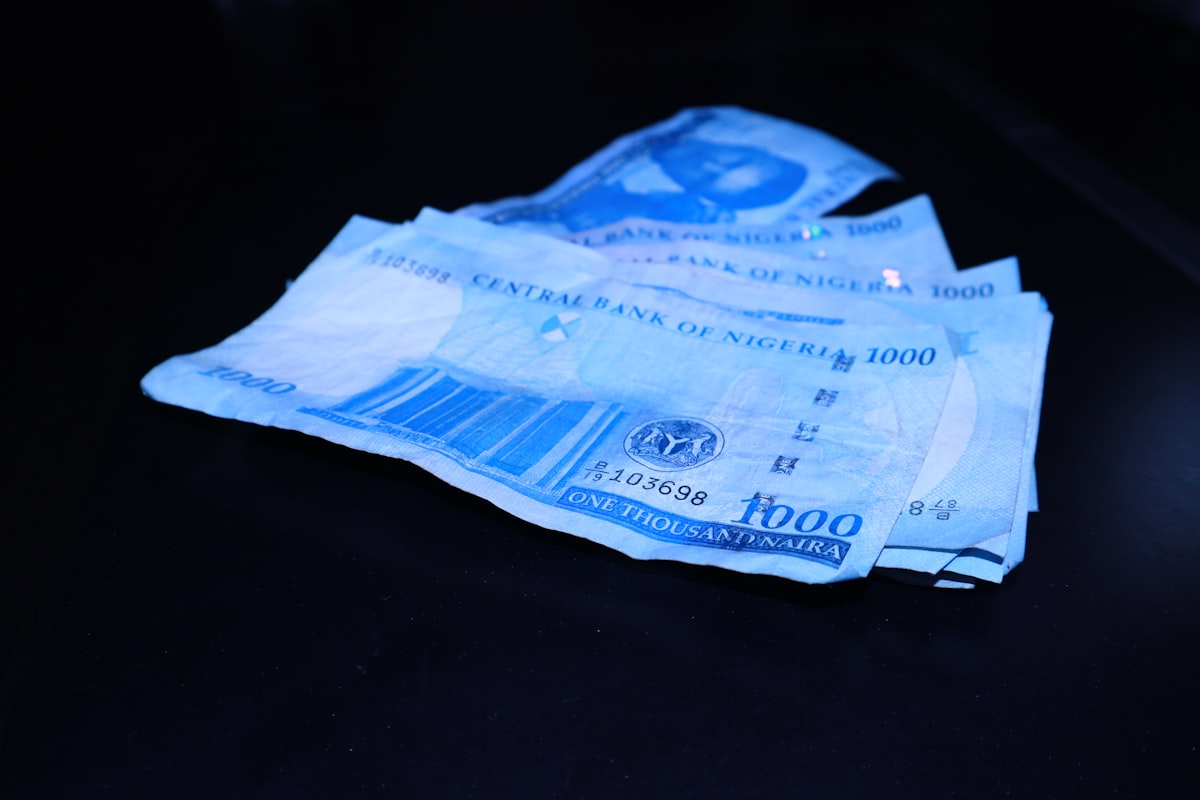 Cash and bills spread out on a table, representing the hidden financial costs of drinking