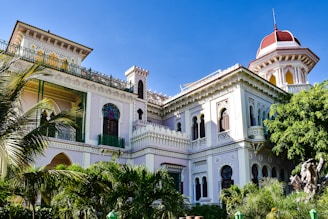 a large white building with a red roof