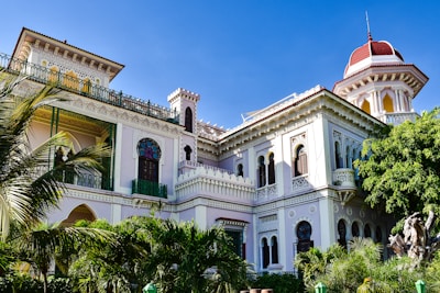 a large white building with a red roof